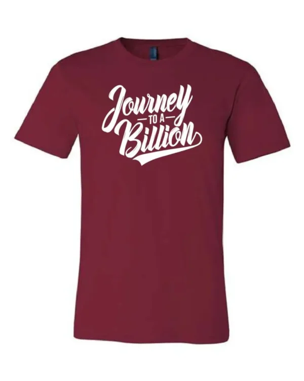 A maroon t-shirt with the words journey is a billion written in white.