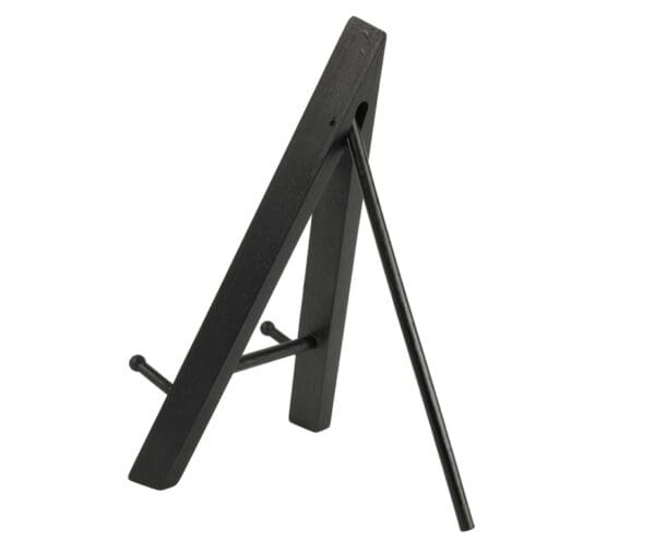 Side view of a black wooden easel, displayed in an open position, isolated on a white background.